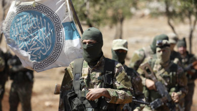 Syrian fighters attend a mock battle in anticipation of an attack by the regime on Idlib province and the surrounding countryside, during a graduation of new Hayat Tahrir al-Sham (HTS) members at a camp in the countryside of the northern Idlib province on August 14, 2018