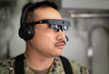 Naval Surface Warfare Center, Port Hueneme Division Fire Controlman Petty Officer 1st Class Donald Tran wears augmented reality glasses during an Augmented Reality Maintenance System demonstration aboard USS Spruance (DDG 111) on April 23. The headset allows a sailor underway to communicate in real time with a subject matter expert working shoreside, while the visor provides a visual of what the sailor sees.